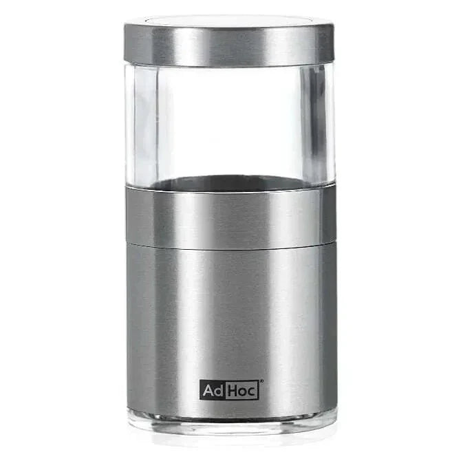 Stainless steel pepper grinder with clear top on a white background