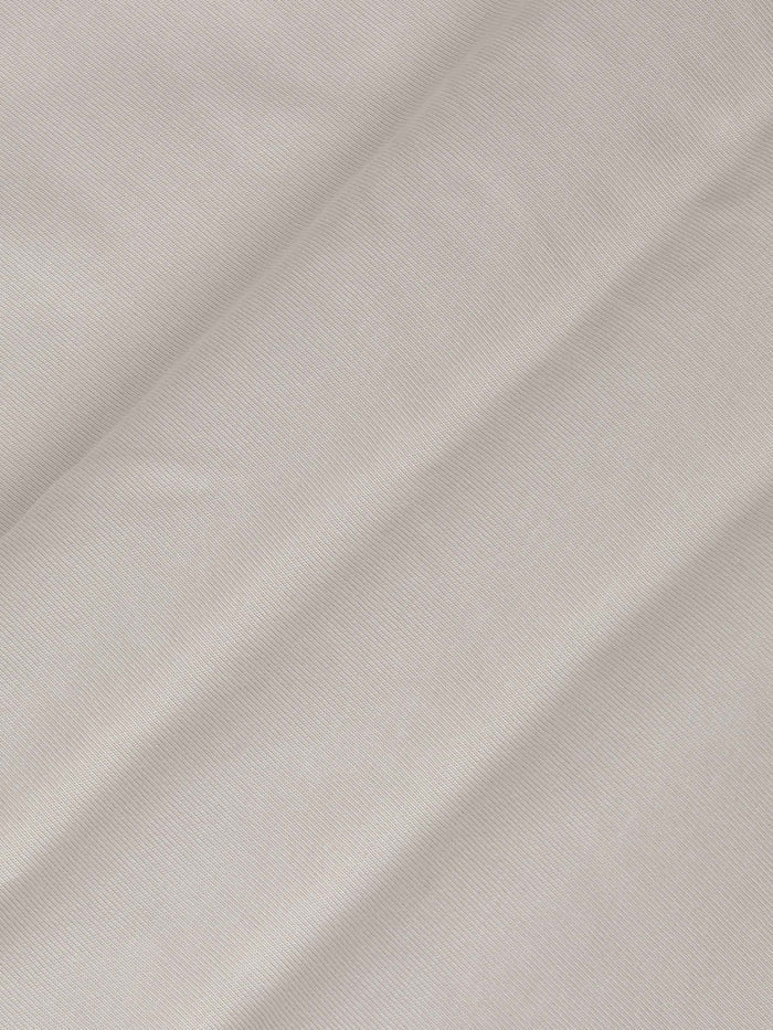 Close-up of The Fervor Light Beige Sweater fabric showing smooth, soft cotton texture – Wam Denim.