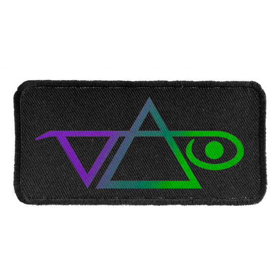 A black patch features the Steve Vai gradient logo with geometric shapes—a triangle, a slanted V to the left, and an oval with a line on the right—blending blue, purple, and green hues seamlessly.