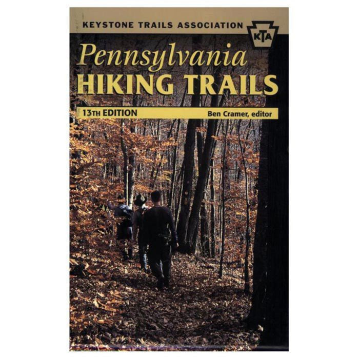 Book cover of 'Pennsylvania Hiking Trails' by Keystone Trails Association with a photo of hikers in a forest.