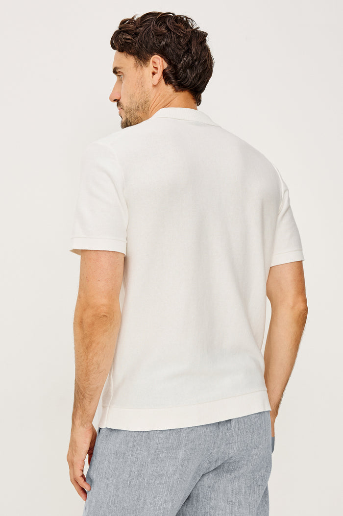 Walden Polo Shirt in Cotton Blend With Collar, Front Buttons, Full Needle Front Applique, and Classic Fit in White Oat Floral Colorway - Upper Body Back View Featured on Model