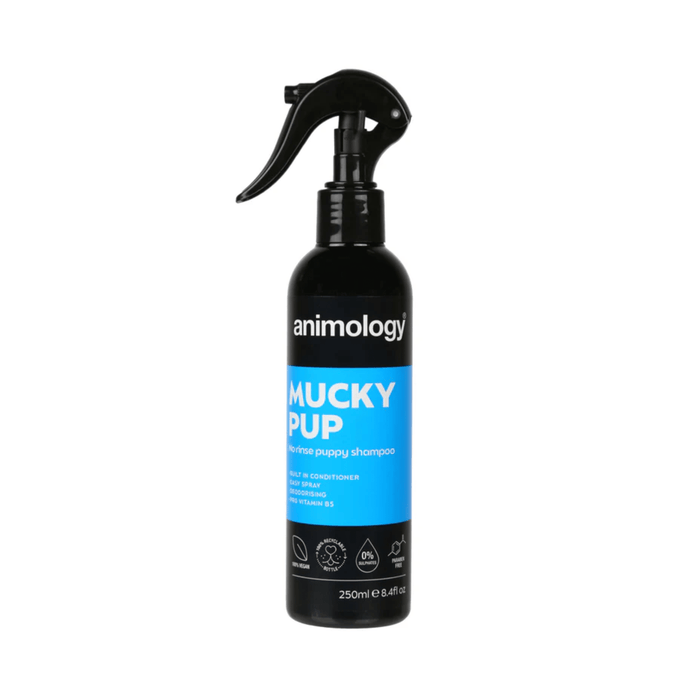 White background with a black and blue spray bottle of Animology Mucky Pup Shampoo. On the bottle is white text 'Animology Mucky Pup, No rinse puppy shampoo'.