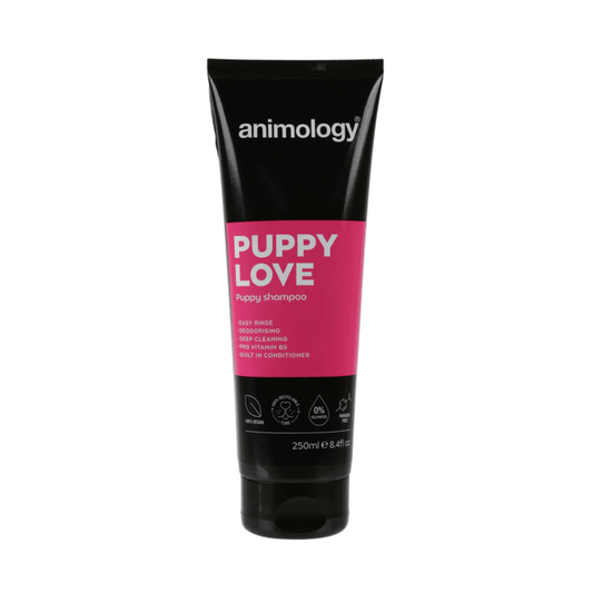 White background with a black and pink  bottle of Animology Puppy Love Shampoo. On the bottle is white text 'Animology Puppy Love, Puppy shampoo'.