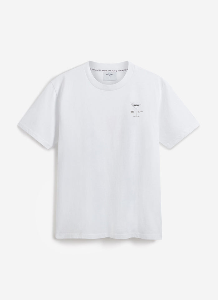 The Percival Bartender Oversized T-shirt in white organic cotton, laid flat to showcase the front and chest cocktail graphic.