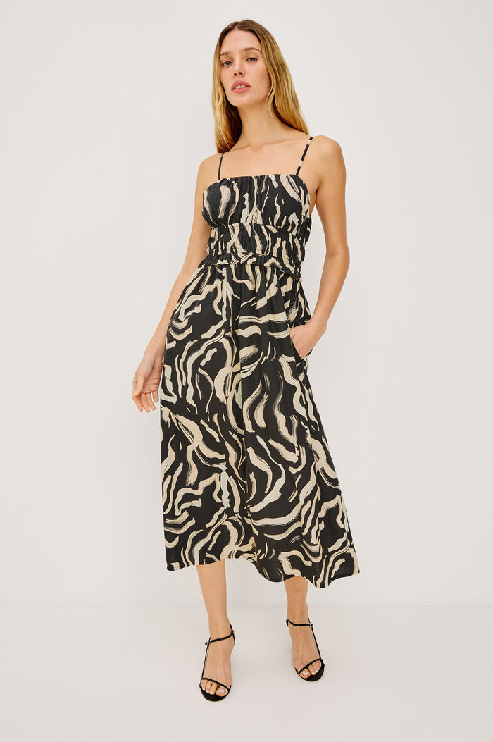 Breeze Midi Dress in Cotton Poplin With Adjustable Spaghetti Shoulder Straps, Gathered Bust, Smocked Waist, Side Pockets, and Full Skirt in Caicos Colorway - Full Body Front View Featured on Model