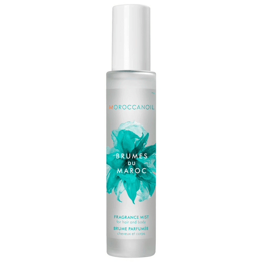 Clear frosted bottle of Brumes Du Maroc - Hair & Body Fragrance Mist | Moroccanoil with teal floral design and white cap for skincare and body care.