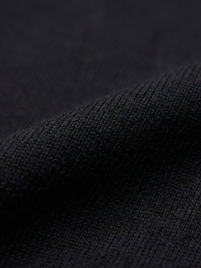 Close-up of black cotton fabric texture, soft breathable material detail