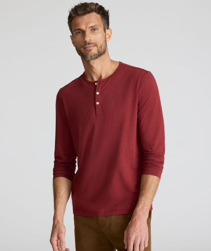 Model is wearing UNTUCKit EcoSoft Henley in Burgundy.