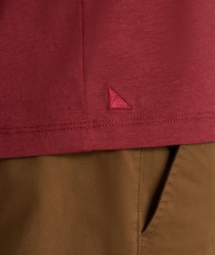 Model is wearing UNTUCKit EcoSoft Henley in Burgundy.