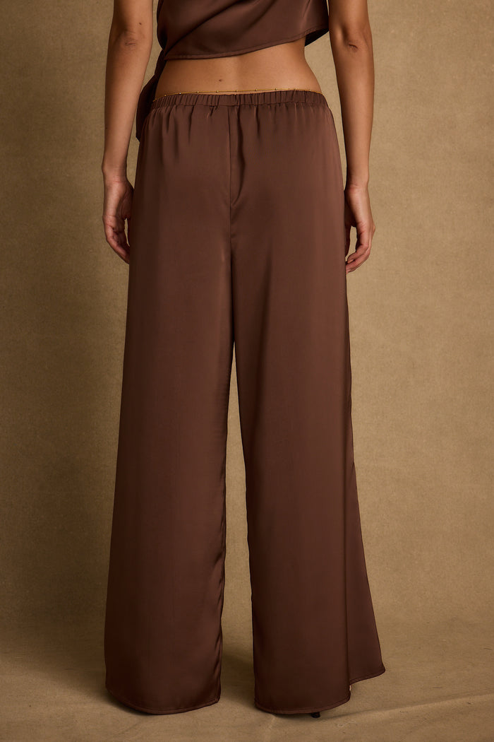Estelle Espresso Satin Pant paired with complementary accessories for a polished look.
