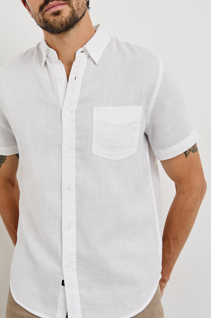 Fairfax short sleeve relaxed fit button up shirt with collar and chest pocket in White - close up of details on model