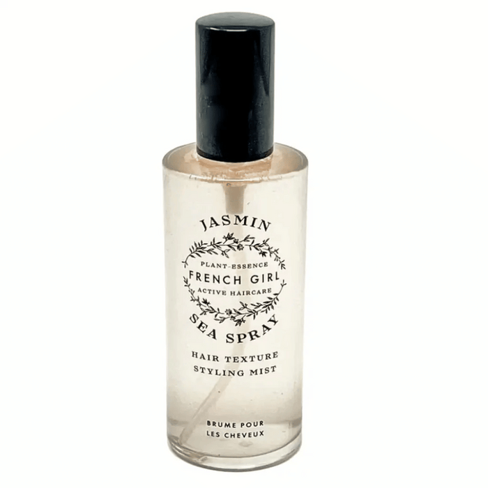 Clear bottle of Jasmin Sea Spray - Hair Texture Mist | French Girl with black cap and simple botanical design on label, styling mist for textured hair.
