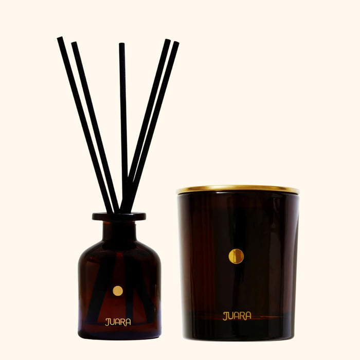 JUARA candle diffuser set with bottle and sticks on a white background.