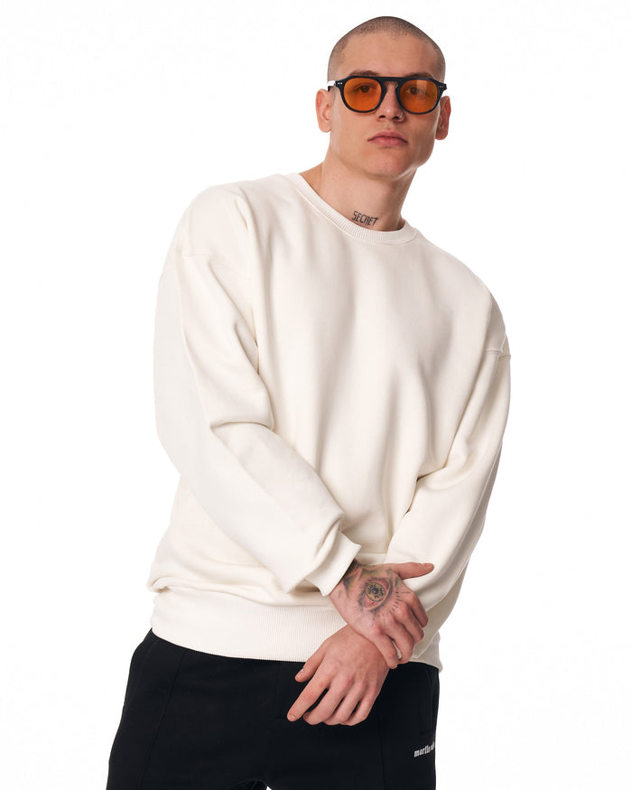 Martin Valen men's oversized white sweatshirt, partial front view showing chest, sleeves and a small side label