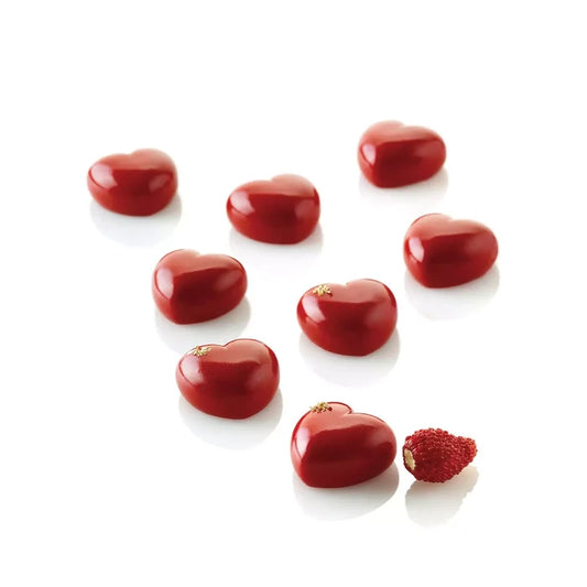 Red heart-shaped pastries on a white background.