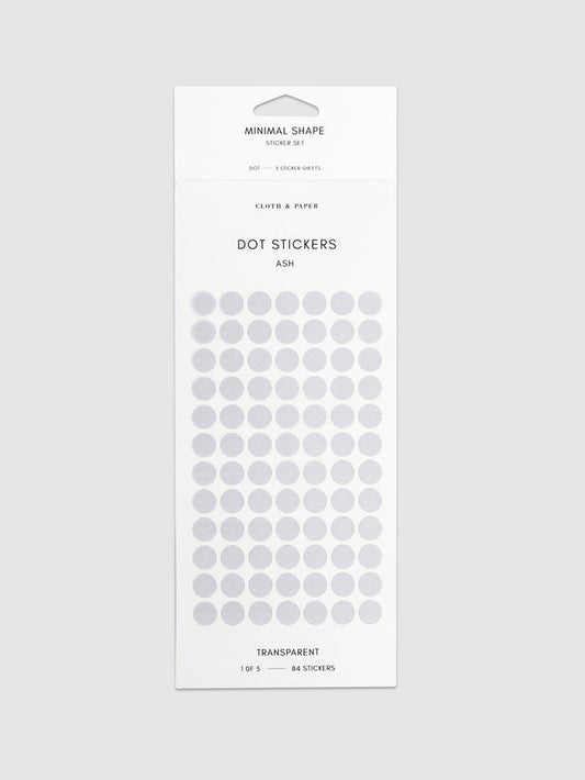 Minimal Shape Sticker Set, Transparent Dots, Ash, Cloth and Paper. Dot stickers in their packaging on a neutral background.