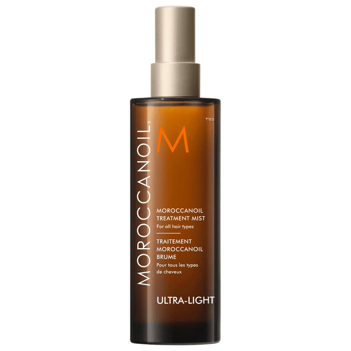 Moroccanoil Treatment Mist - Full Size | Moroccanoil ultra-light hair treatment spray in an amber bottle with a beige spray cap for all hair types.
