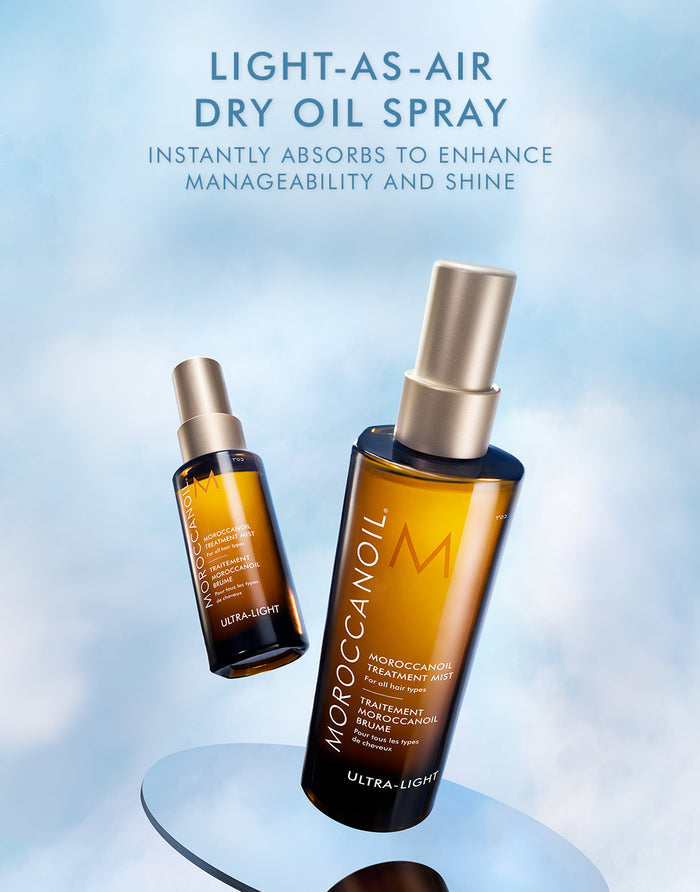 Moroccanoil Treatment Mist - Full Size | Moroccanoil light-as-air dry oil spray in amber bottle with gold cap, designed to instantly absorb and enhance hair manageability and shine.