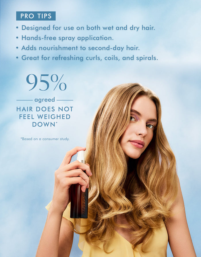 Woman with long wavy blonde hair holds a spray bottle demonstrating the use of Moroccanoil Treatment Mist - Full Size | Moroccanoil, with text highlighting it nourishes hair without weighing it down.