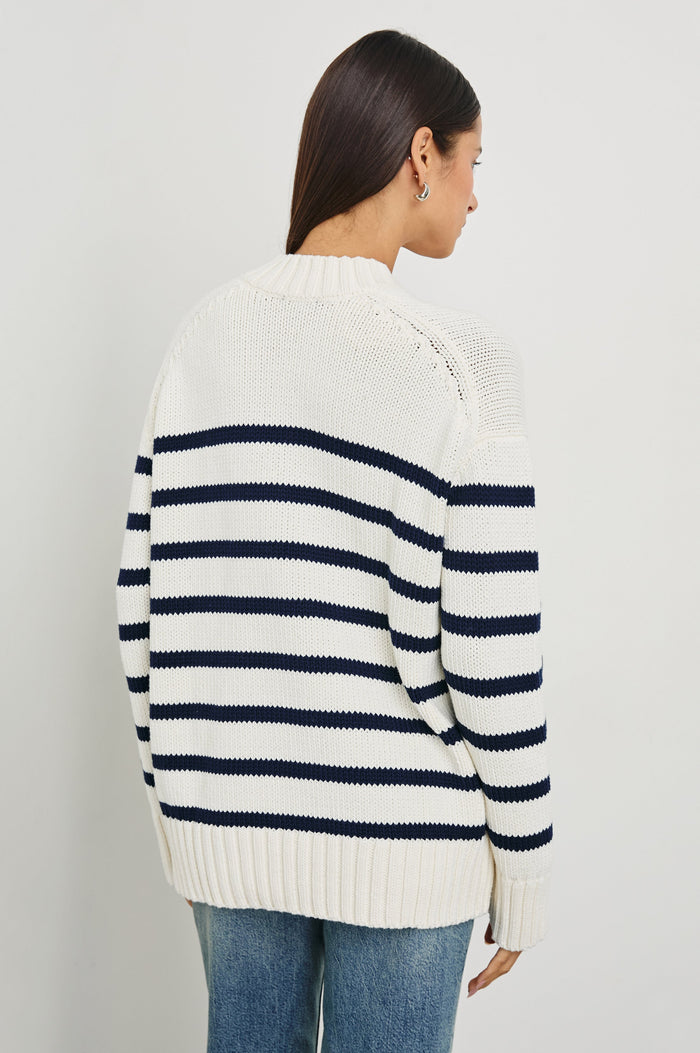 Penny Long-Sleeve, V Neck Sweater with Ribbed Trim in Ivory Navy Stripe Colorway, Horizontal Stripes - Back View Featured on Model