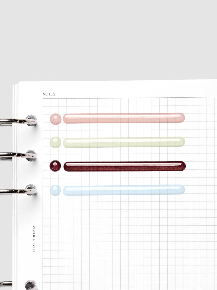 Raised Stickers in Bordeaux, Smoked Salt, Matcha, and Fig Milk shown on a planner page.