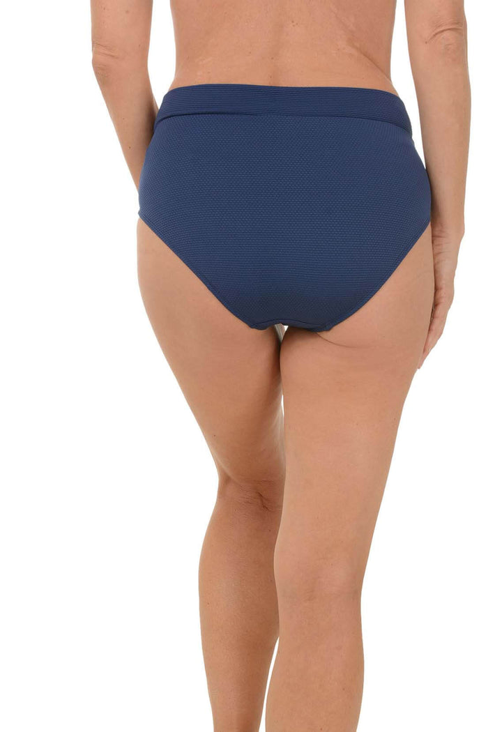 Navy blue bikini bottom worn by a person on a white background. Back shot.