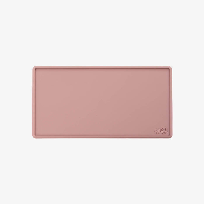 The Tiny Placemat in Blush is a non-slip, silicone placemat that fits on most highchair trays