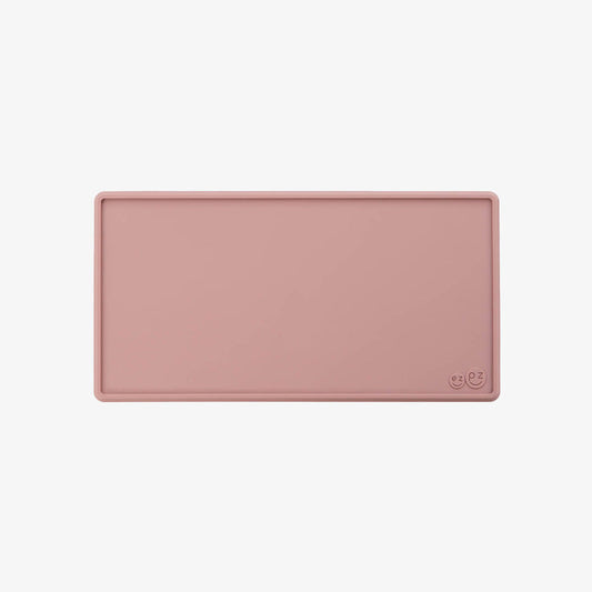 The Tiny Placemat in Blush is a non-slip, silicone placemat that fits on most highchair trays