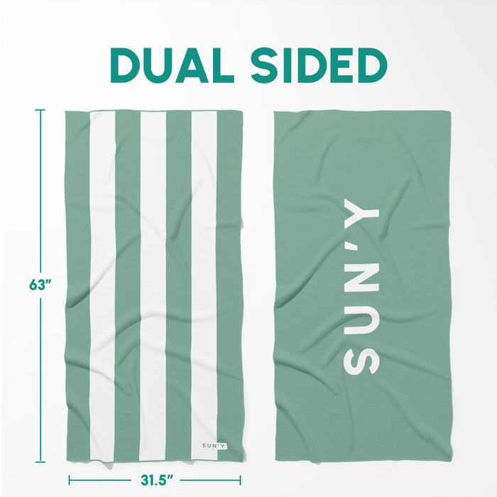 Waffle Microfiber Beach Towel - Sea Green | SUN'Y shown with its dual-sided design featuring green and white stripes on one side and solid sea green with SUN'Y branding on the other.