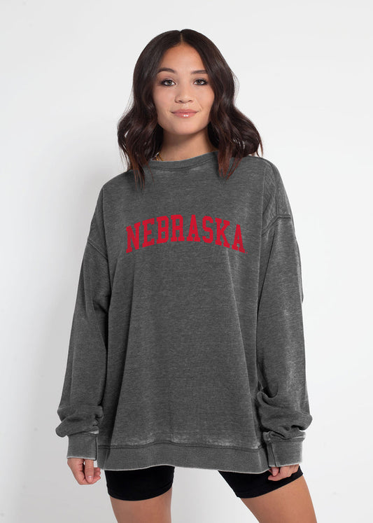 Nebraska Cornhuskers Unisex Charcoal Oversized Burnout fleece Sweatshirt with Ribbed crew neckline, cuffs, hem, dropped shoulders and relaxed bottom hem